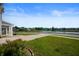 Lush front lawn with view of neighborhood lake and sidewalk at 1328 Plover Dr, Greenwood, IN 46143
