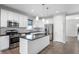 Modern kitchen with stainless steel appliances, white cabinetry, and a center island at 1328 Plover Dr, Greenwood, IN 46143