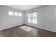 Bright, airy living room with a modern color scheme, large window, and durable wood-look flooring at 1328 Plover Dr, Greenwood, IN 46143