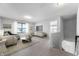 Comfortable living room features a stylish couch, modern decor, and an abundance of natural light at 1328 Plover Dr, Greenwood, IN 46143