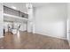 Open-concept living space with wood-look flooring, offering flexible layout options and access to outdoor areas at 1328 Plover Dr, Greenwood, IN 46143