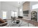 Grand living room with soaring ceilings, statement fireplace, and elegant chandelier lighting at 1328 Plover Dr, Greenwood, IN 46143
