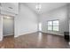 Bright living area with wood-look flooring, large windows and access to the backyard at 1328 Plover Dr, Greenwood, IN 46143