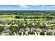 Stunning aerial view of the golf course neighborhood, featuring scenic views and beautiful homes at 15410 Mission Hills Dr, Carmel, IN 46033