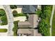 Aerial view of a residential property with a well-maintained lawn and a paved driveway at 15410 Mission Hills Dr, Carmel, IN 46033