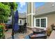 Enjoy outdoor living on the spacious back deck with stylish furniture and a charming outdoor setting at 15410 Mission Hills Dr, Carmel, IN 46033