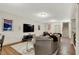 Spacious basement featuring a cozy seating area, entertainment center, and stair access to the main floor at 15410 Mission Hills Dr, Carmel, IN 46033