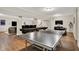 Recreational basement featuring shuffleboard, ping pong, and an open layout perfect for entertainment at 15410 Mission Hills Dr, Carmel, IN 46033