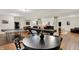Finished basement features a table and chairs, game tables, and an open layout for flexible use at 15410 Mission Hills Dr, Carmel, IN 46033