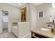 Bright bathroom features a soaking tub and a vanity with granite countertops at 15410 Mission Hills Dr, Carmel, IN 46033