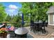 Outdoor deck with plenty of seating, an umbrella, and a view of trees at 15410 Mission Hills Dr, Carmel, IN 46033