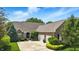 Charming brick home with a well-manicured front lawn and attached two-car garage at 15410 Mission Hills Dr, Carmel, IN 46033