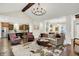 Open living space with a view of the kitchen, dining areas, and a cozy living room at 15410 Mission Hills Dr, Carmel, IN 46033