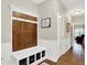 A mudroom features a built-in bench with storage, perfect for organization at 15410 Mission Hills Dr, Carmel, IN 46033