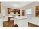 A home office featuring beautiful hardwood floors, built-in cabinets, and ample workspace at 15410 Mission Hills Dr, Carmel, IN 46033