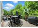 Inviting outdoor patio with a dining table, seating, and barbecue grill at 15410 Mission Hills Dr, Carmel, IN 46033