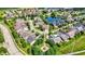 A tranquil community featuring a circular street design, mature trees and community pond at 15529 Mission Hills Dr, Carmel, IN 46033