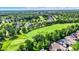 Picturesque aerial view of neighborhood backing onto well-maintained golf course and ponds at 15529 Mission Hills Dr, Carmel, IN 46033