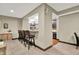 Basement bar area with seating, granite countertops, and mirrored backsplash perfect for entertaining at 15529 Mission Hills Dr, Carmel, IN 46033
