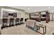 Basement wet bar area with seating, granite countertops, and mirrored backsplash perfect for entertaining at 15529 Mission Hills Dr, Carmel, IN 46033