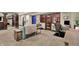 Basement area with home theatre and wine cellar and comfortable seating at 15529 Mission Hills Dr, Carmel, IN 46033