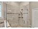 Shower features a frameless shower door, decorative tile, and rainfall shower head at 15529 Mission Hills Dr, Carmel, IN 46033