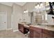 Bathroom with double sink vanity with granite countertops, makeup area, and walk-in shower at 15529 Mission Hills Dr, Carmel, IN 46033