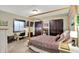 Bedroom with wood frame bed, closet, desk and TV at 15529 Mission Hills Dr, Carmel, IN 46033