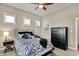 A lovely bedroom featuring neutral walls, a decorative bed, and a dark wood dresser at 15529 Mission Hills Dr, Carmel, IN 46033