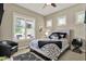 Comfortable bedroom featuring large windows providing natural light and a ceiling fan at 15529 Mission Hills Dr, Carmel, IN 46033