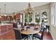 Dining area with hardwood floors and large windows at 15529 Mission Hills Dr, Carmel, IN 46033