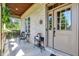 Charming front porch with seating area and welcoming entrance at 15529 Mission Hills Dr, Carmel, IN 46033