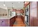 Kitchen featuring granite counters, stainless appliances, and a large kitchen island with seating at 15529 Mission Hills Dr, Carmel, IN 46033