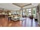 Open-concept living room featuring hardwood floors, ample seating, and natural light at 15529 Mission Hills Dr, Carmel, IN 46033