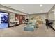 The inviting living area boasts cozy seating, a wine cellar, and an abundance of natural light at 15529 Mission Hills Dr, Carmel, IN 46033