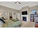 Main bedroom includes a fireplace, television, and ensuite access at 15529 Mission Hills Dr, Carmel, IN 46033