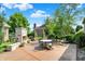 Cozy patio featuring an outdoor fireplace, ideal for gatherings at 15529 Mission Hills Dr, Carmel, IN 46033