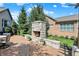 Cozy patio featuring an outdoor fireplace and landscaped yard, perfect for outdoor gatherings at 15529 Mission Hills Dr, Carmel, IN 46033