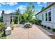 Inviting patio area with an outdoor dining set, perfect for entertaining and relaxation at 15529 Mission Hills Dr, Carmel, IN 46033