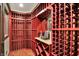 Custom designed wine cellar with shelving for wine bottle storage at 15529 Mission Hills Dr, Carmel, IN 46033
