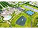 Aerial view of community clubhouse with pool, tennis courts, ponds, and parking at 15946 Marsala Dr, Fishers, IN 46037