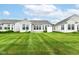 A view of the community backyard, with a well-maintained lawn, with lots of natural light at 15946 Marsala Dr, Fishers, IN 46037