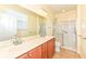 Bathroom featuring double sinks, wood cabinets, framed mirror and stand-up shower at 15946 Marsala Dr, Fishers, IN 46037
