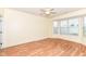 A bright bedroom features laminate wood flooring and a bay window with neighborhood views at 15946 Marsala Dr, Fishers, IN 46037