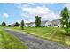 A view of the community, with a well-maintained lawn and sidewalk at 15946 Marsala Dr, Fishers, IN 46037
