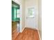 Bright entryway features wood floors and a white door leading to the outside at 15946 Marsala Dr, Fishers, IN 46037