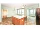 Kitchen with a center island, wood cabinets, eat-in nook, and tile flooring at 15946 Marsala Dr, Fishers, IN 46037