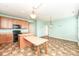 Kitchen with a central island, wood cabinets, and views into other rooms at 15946 Marsala Dr, Fishers, IN 46037