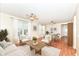 Bright, open-concept living room featuring neutral tones, a ceiling fan and ample natural light at 15946 Marsala Dr, Fishers, IN 46037