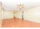 Spacious living room featuring wood-look floors, neutral walls, and a view to other rooms at 15946 Marsala Dr, Fishers, IN 46037